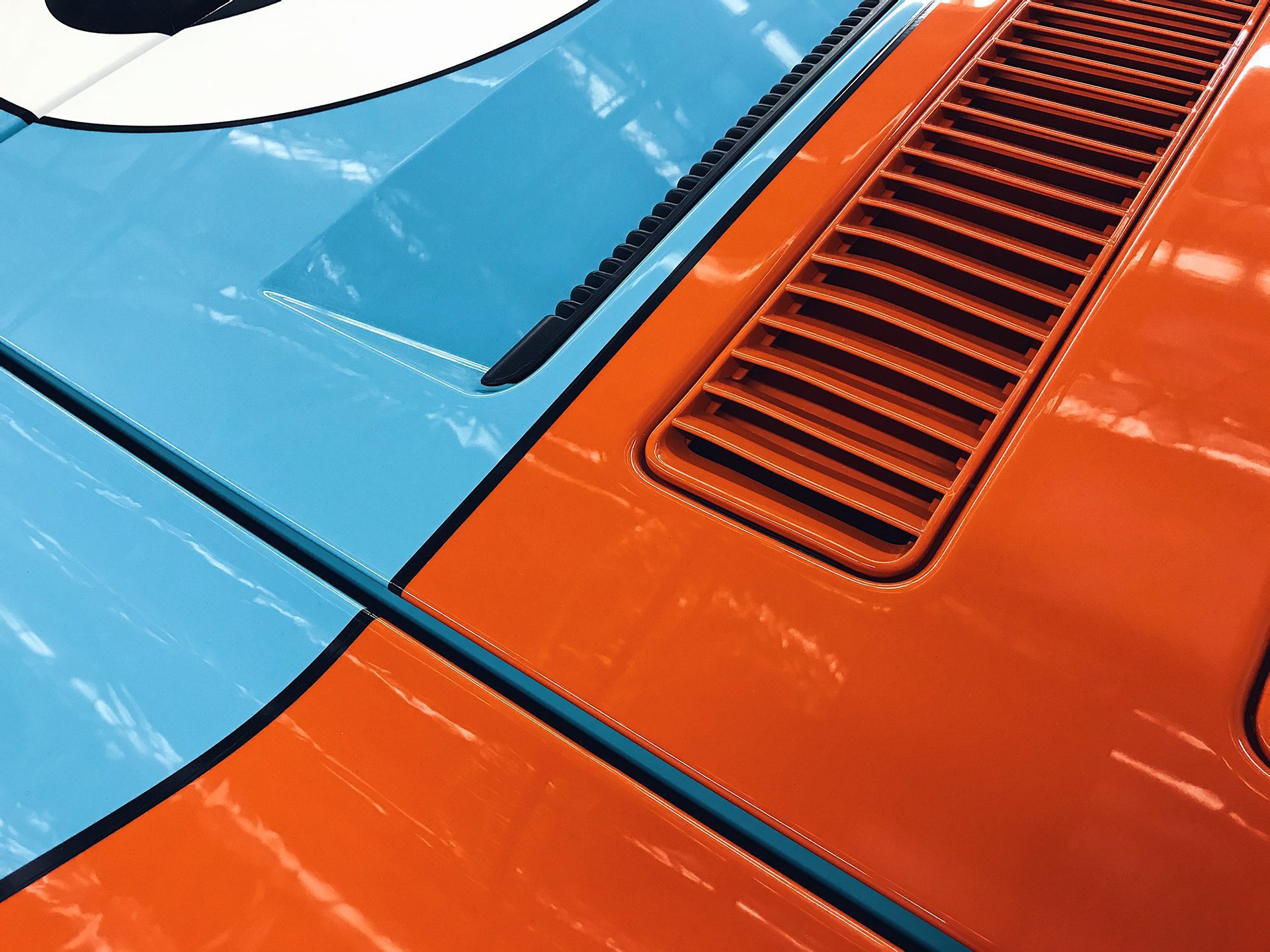 Ford GT Heritage bodywork reflecting shop lights after coating