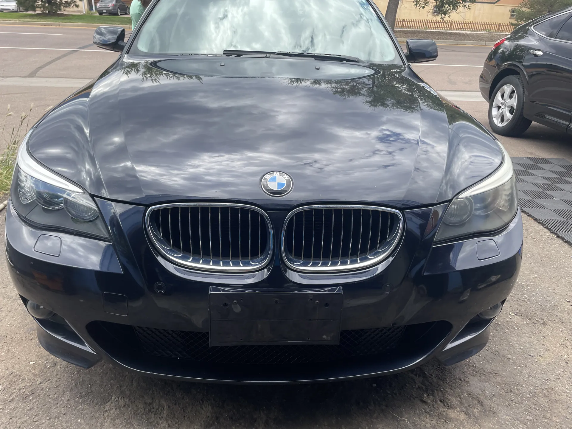 Black BMW 5 Series front end at ST6 Detailers, Colorado Springs
