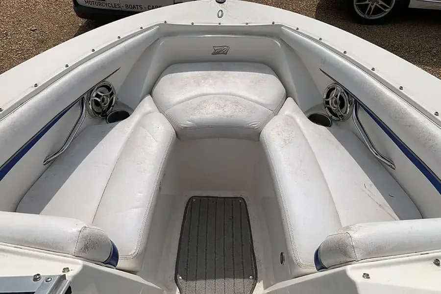 White bow seating with grey staining across the vinyl before cleaning