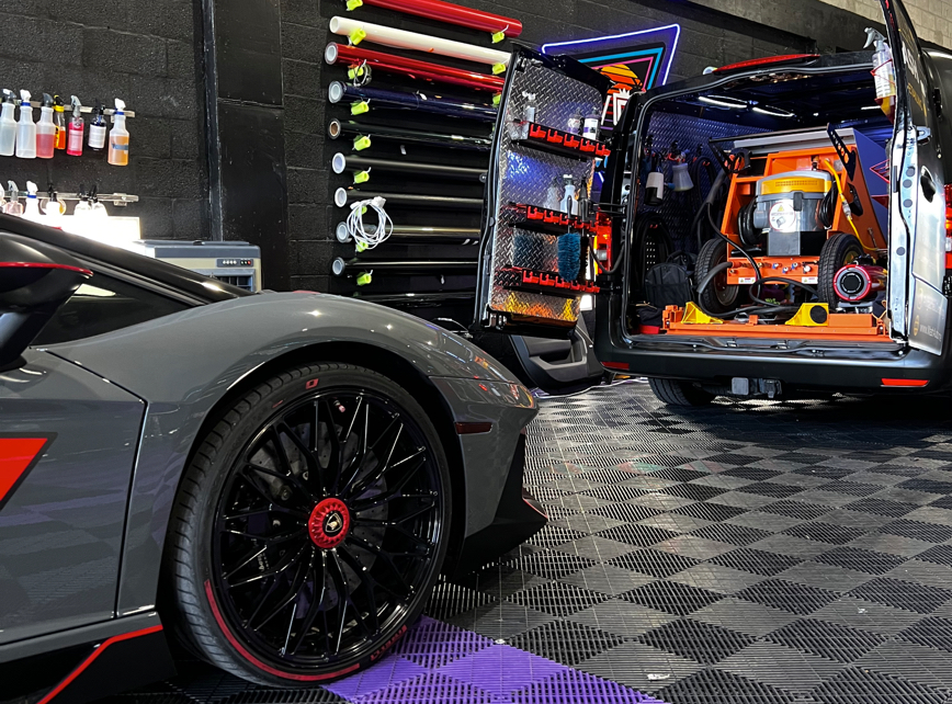 ST6 mobile detailing unit set up beside a Lamborghini