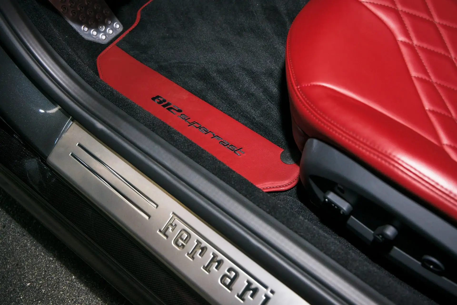 Ferrari 812 Superfast door sill and red leather seat detailed by ST6 Detailers in Colorado Springs