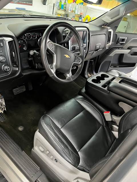 Chevrolet Silverado black leather driver seat, steering wheel and center console
