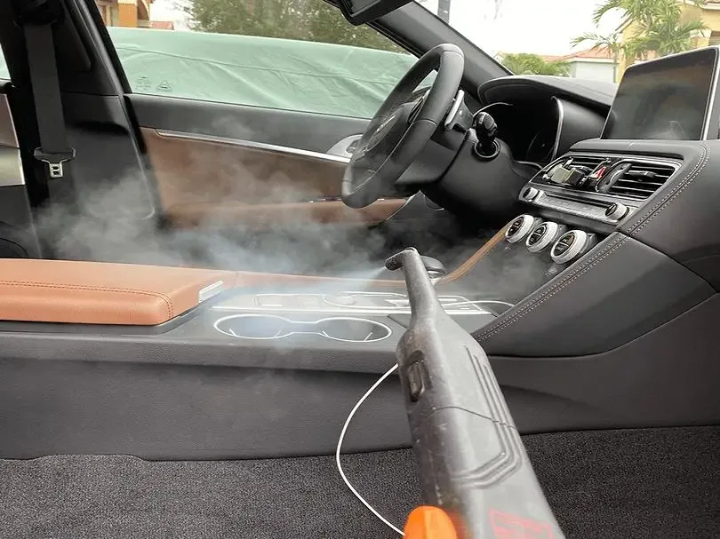 ST6 technician steam treating a vehicle interior