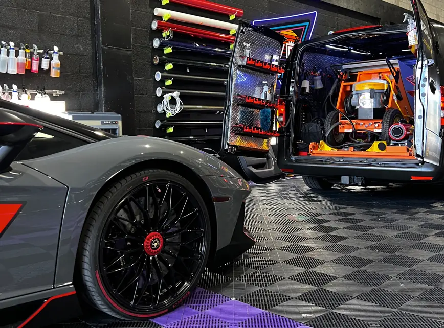 ST6 mobile detailing unit set up beside a Lamborghini