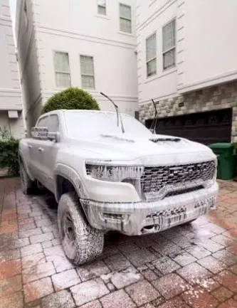 White Ram TRX covered in foam before paint correction