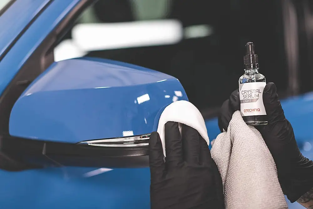 ST6 Detailers applying Gtechniq Crystal Serum Light to a BMW panel in Colorado Springs