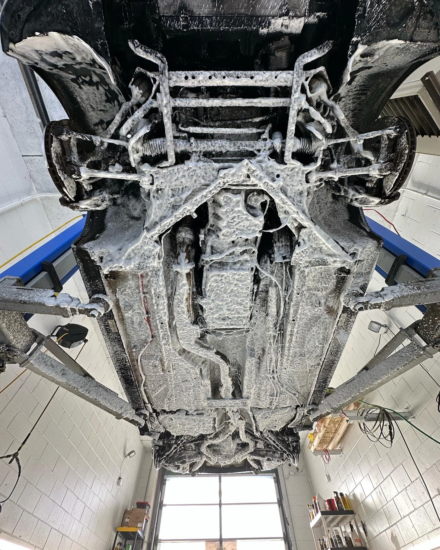 Foam cleaning on accessible undercarriage surfaces
