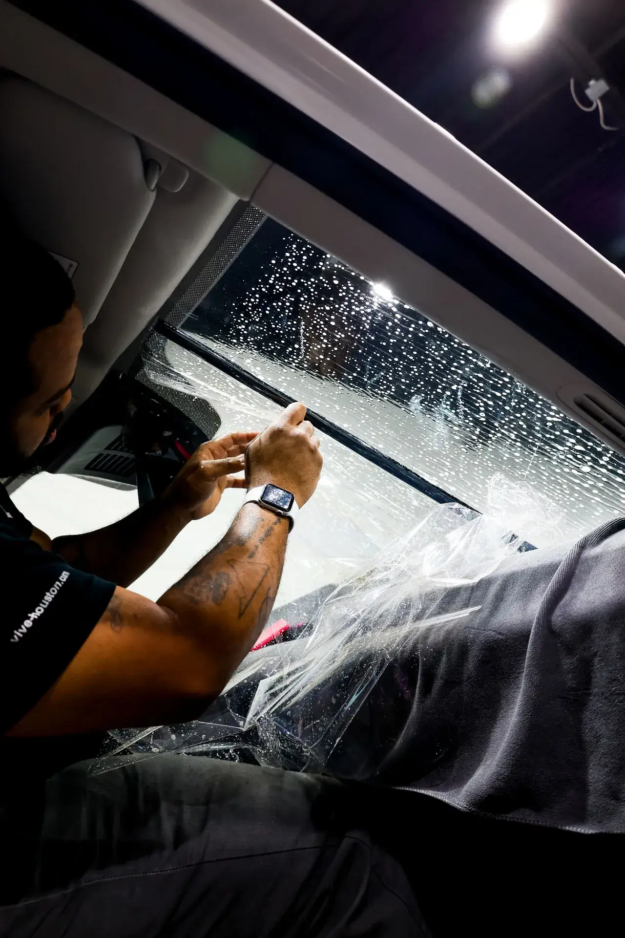 Windshield window tint being installed, Colorado Springs